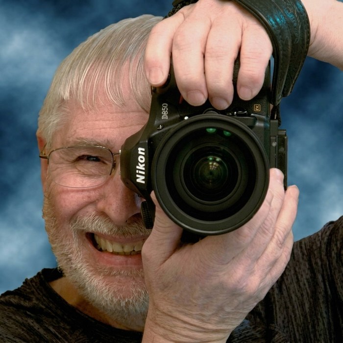 Portrait of photographer Mike Skultety with his Nikon D850