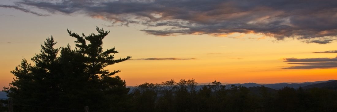 Panoramic sunset stretching across rolling Blue Ridge horizons — Blue Ridge Parkway
