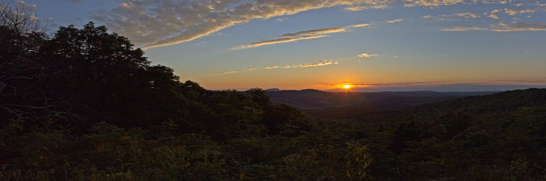 Wide panoramic sunset over the layered Blue Ridge Mountains — Blue Ridge Parkway